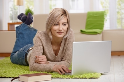 Woman browsing internet on laptop