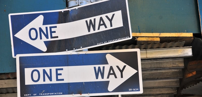 one way signs opposing each other