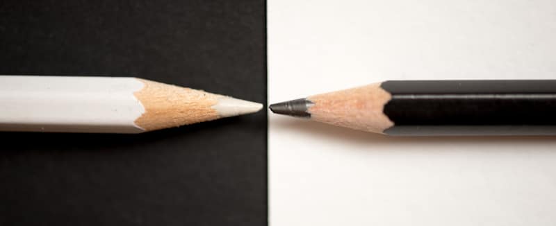 white pencil black pencil opposing