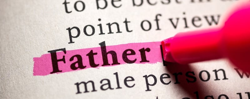 father definition highlighted on dictionary