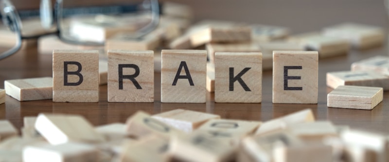 brake spelled in wooden blocks