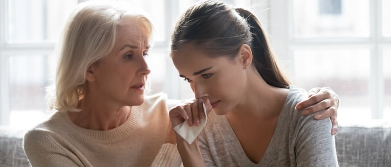 woman shows sympathy to another