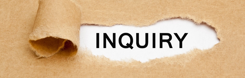 inquiry sign pealed off on white paper