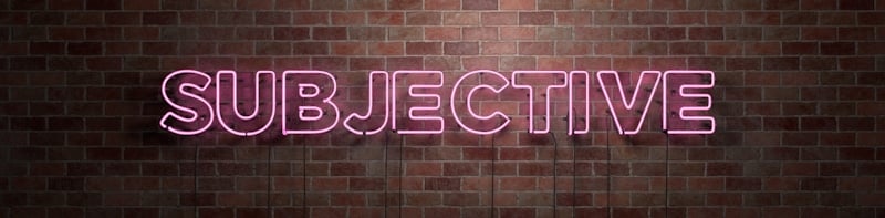 subjective word sign in neon letters