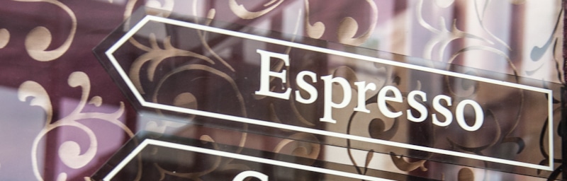 espresso sign arrow in tinted glass