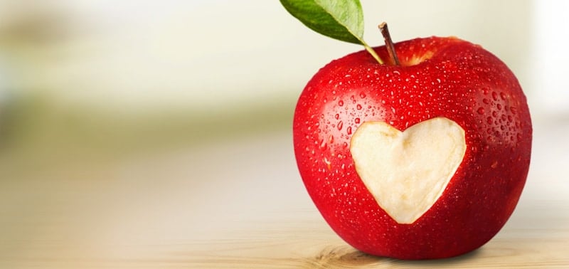bright red apple with heart carved 1