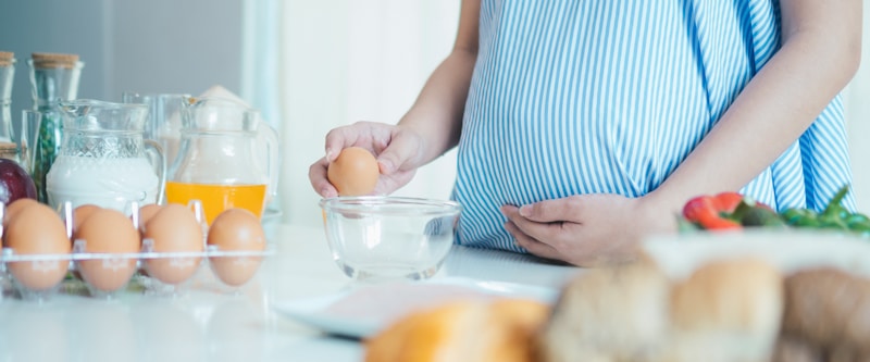 pregnant woman about to make bread