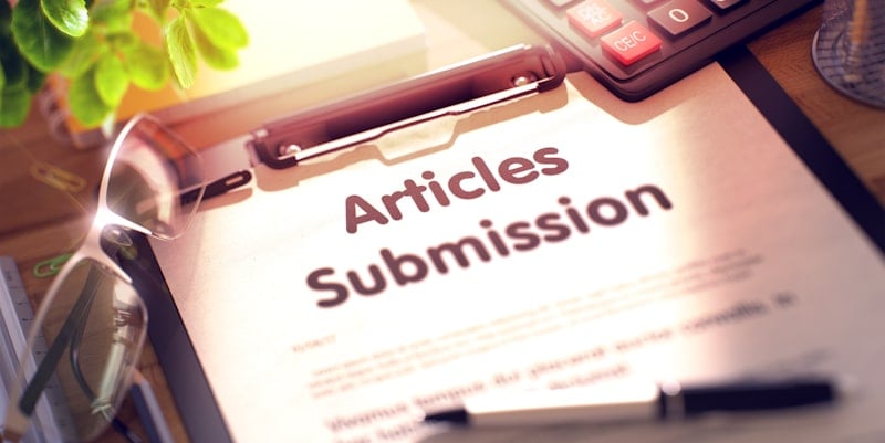article submission sign written on clip notepad