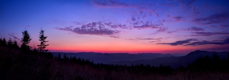 purple hued sunrise in the mountains