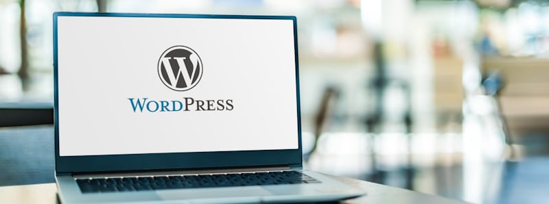 wordpress site and logo on laptop editorial image