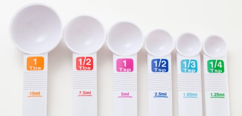 set of white tbs meassure spoons