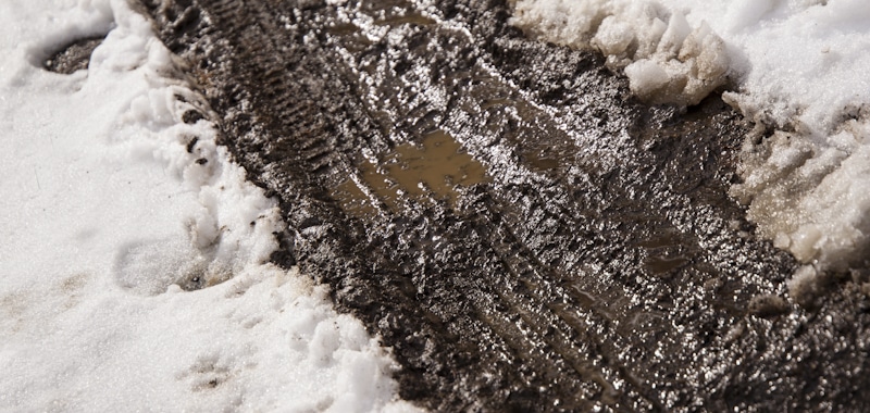 slushy road covered in snow