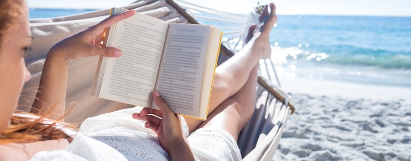 reading beach woman